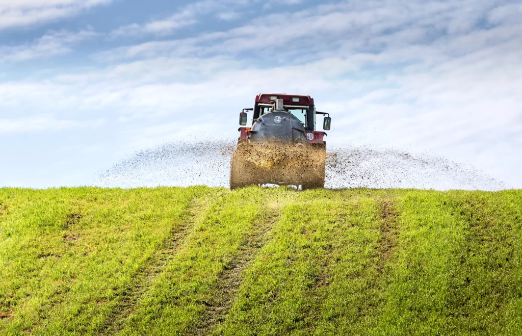 Tractor fertilising pasture